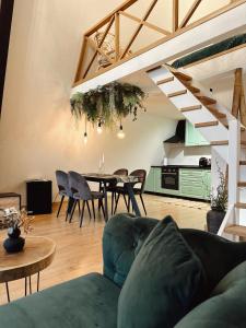 a living room with a couch and a table at Porumbacu Garden in Porumbacu de Sus