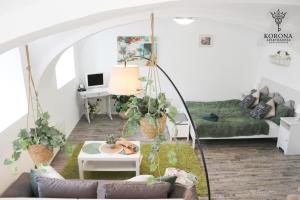 a living room with a couch and a table at Korona Apartman Székesfehérvár in Székesfehérvár