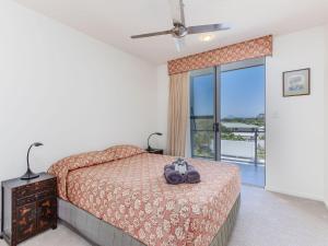 Ένα ή περισσότερα κρεβάτια σε δωμάτιο στο Ming 3 Beachfront on Marine Parade