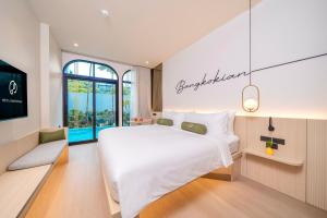 Postel nebo postele na pokoji v ubytování Hotel Bangkokian