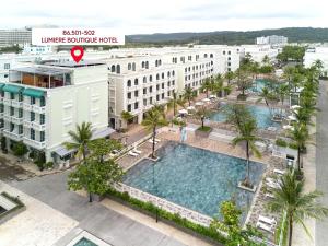 an overhead view of a building with a large swimming pool at Lumiere Boutique Phu Quoc Hotel in Phu Quoc
