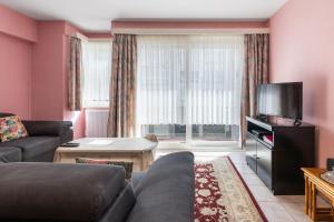 TV a/nebo společenská místnost v ubytování Ruytingen C2