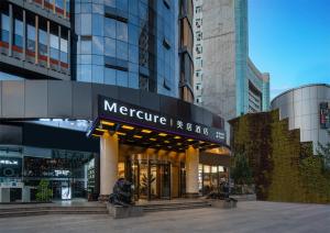 a store front of a building in a city at Mercure Hotel in Xi'an