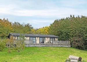 a house in the middle of a field at Henfields Country Retreat in Otterhampton