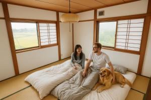 Postel nebo postele na pokoji v ubytování Guesthouse & Sharehouse カリマ安曇沓掛