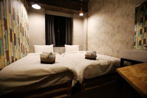 Postel nebo postele na pokoji v ubytování NYS Loft Hotel