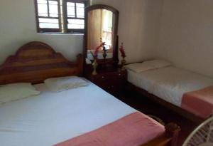 Postel nebo postele na pokoji v ubytování Safari Homestay