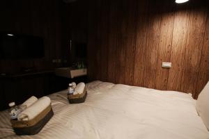 Postel nebo postele na pokoji v ubytování NYS Loft Hotel