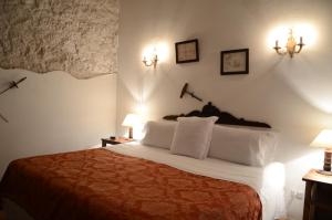 Ένα ή περισσότερα κρεβάτια σε δωμάτιο στο Alfiz Hotel