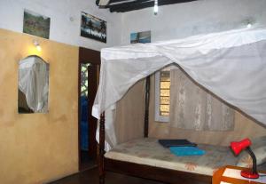 Voodi või voodid majutusasutuse JamboHouse Lamu toas