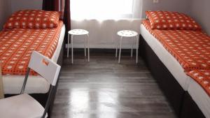 Posteľ alebo postele v izbe v ubytovaní Hostel Kamienna Centrum