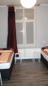 Posteľ alebo postele v izbe v ubytovaní Hostel Kamienna Centrum