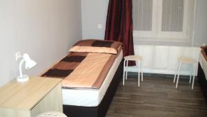 Posteľ alebo postele v izbe v ubytovaní Hostel Kamienna Centrum