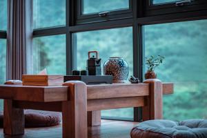 a table in front of a large window at Sanctum Peaks in Zhangjiajie