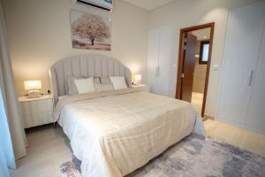 Ένα ή περισσότερα κρεβάτια σε δωμάτιο στο Villa AZ - Hawana Salalah +8 φωτογραφίες