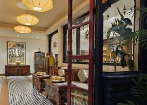 a living room with a couch and a table at Central Courtyard Thamel - Kathmandu's Best Kept Secret in Kathmandu +37 photos