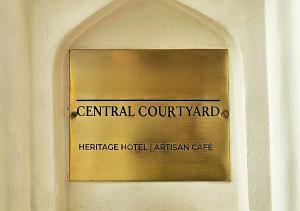 a sign for the centennial court yard on a building at Central Courtyard Thamel - Kathmandu's Best Kept Secret in Kathmandu