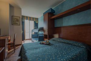 Postel nebo postele na pokoji v ubytování Park Hotel Perù ***S
