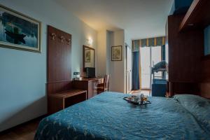 Postel nebo postele na pokoji v ubytování Park Hotel Perù ***S