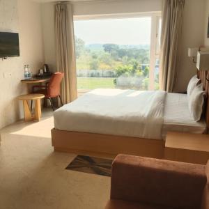 Postel nebo postele na pokoji v ubytování Zuke Garden Hotel & Resort