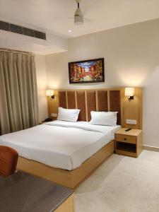 Postel nebo postele na pokoji v ubytování Zuke Garden Hotel & Resort