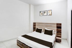 Giường trong phòng chung tại Hotel O Chaudhary Guest House