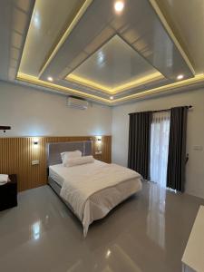 Ένα ή περισσότερα κρεβάτια σε δωμάτιο στο Nata home stay