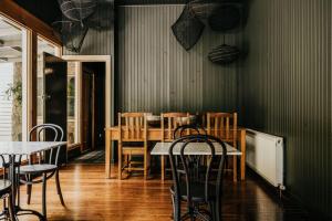 a dining room with a table and chairs at The Amalfi House in Hepburn Springs +31 photos