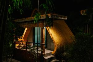 a night view of a house with a staircase at Laydaman Art Homestay in Ao Luk +63 photos