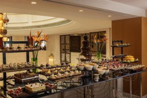 a buffet line with many different types of desserts at Kempinski Nile Hotel, Cairo in Cairo