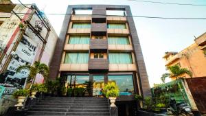 a building with stairs in front of it at HOTEL GARNET in Durg