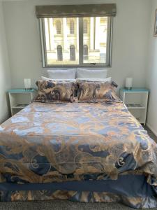 Postel nebo postele na pokoji v ubytování The Penguins Nest