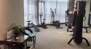 a room with a gym with exercise equipment in it at Ease Hotel Xi'an High-tech Zone 4th Zhangba Road Metro Station in Xi'an