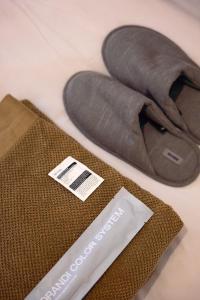 a pair of shoes and a bag on a table at Zeus Holiday Home in Pissouri