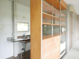 a small bathroom with a sink and a sink at OGUNI S HOUSE 2F Designed by Toyo Ito in Oguni