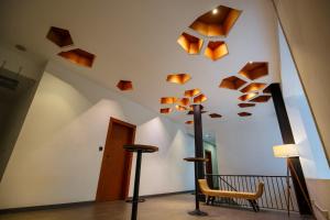 a room with wooden beams on the ceiling at Cheers Social Apartment & Hotel BKK1 in Phnom Penh +71 photos
