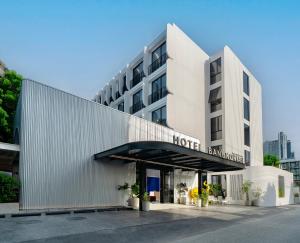 a hotel building with a sign that reads hotel barcelona at Hotel Bangkokian in Bangkok +37 photos