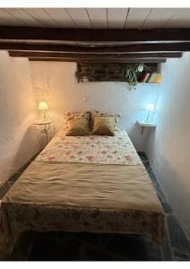 Ένα ή περισσότερα κρεβάτια σε δωμάτιο στο Casa Tia Anica