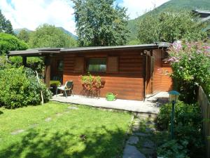 a cabin in a garden with a yard at Gaestehaus-Staats in Obervellach