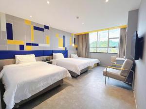 Ένα ή περισσότερα κρεβάτια σε δωμάτιο στο 7 Days Inn Changsha Xingsha Zhongmaocheng Windows of the World +193 φωτογραφίες