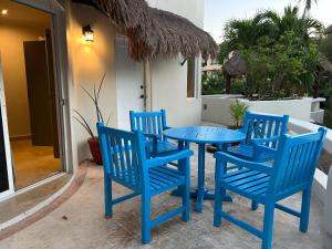 a blue table and chairs on a patio at Blue angel 24 in Playa del Carmen