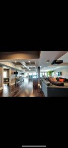 a large living room with a couch and a chair at White Rock Joy Inn in White Rock