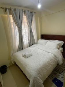 Postel nebo postele na pokoji v ubytování Fahari House