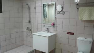 Koupelna v ubytování Mei Hua Hotel