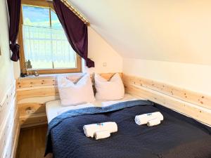 a bedroom with two beds with towels on them at Apartment BergWiese 225 in Donnersbachwald