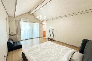 Postel nebo postele na pokoji v ubytování Jeonju Ondo