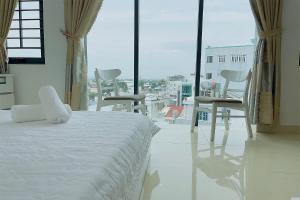 Postel nebo postele na pokoji v ubytování Ruby Star Hotel Apartment + 21 fotografií