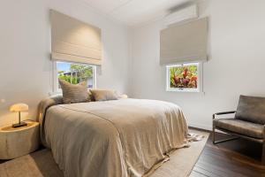 En eller flere senge i et værelse på Calma on Carlyle Lane + 39 billeder