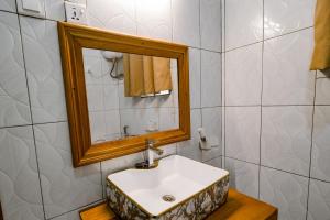 a bathroom with a sink and a mirror at Murugano Village Hotel in Taba +51 photos