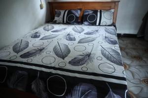 a bedroom with a bed with two cameras on it at Delft Aquatic Tourist Hotel in Delft Centre